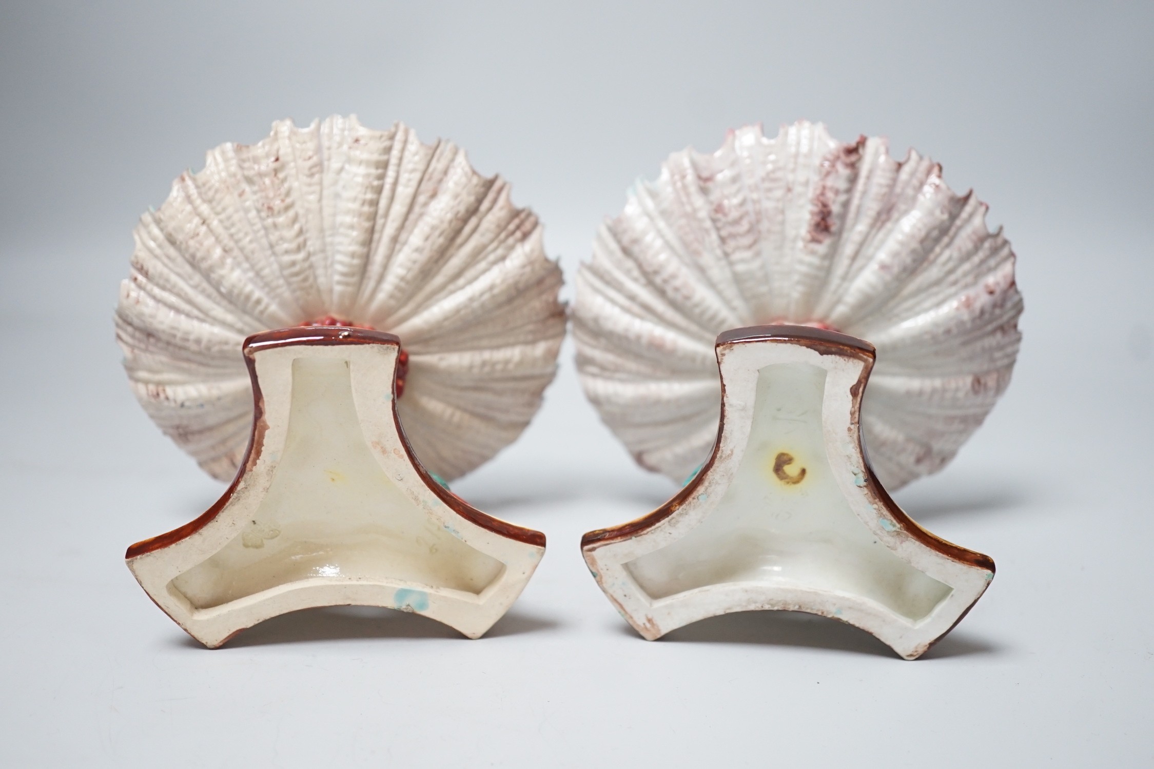 A pair of late 19th century Royal Worcester majolica dolphin comports, 10cm tall